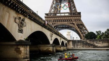 A rescue boat cruises on the Seine river near the Eiffel Tower during a rehearsal for the Paris 2024 Olympic Games opening ceremony, Monday, June. 17, 2024 in Paris. (AP Photo/Thomas Padilla)