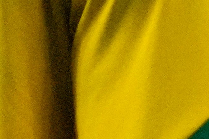 Edson Álvarez tendido en el terreno de juego ante la mirada de los jugadores de las selecciones mexicanas y jamaicanas.