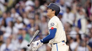 Los Angeles Dodgers' Shohei Ohtani heads to first for a two-run home run during the third inning of a baseball game against the Los Angeles Angels Saturday, June 22, 2024, in Los Angeles. (AP Photo/Mark J. Terrill)
