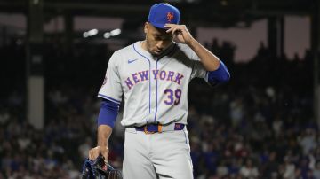 New York Mets relief pitcher Edwin Díaz reacts after being ejected by their base umpire Vic Carapazza during the ninth inning of a baseball game against the Chicago Cubs in Chicago, Sunday, June 23, 2024. (AP Photo/Nam Y. Huh)