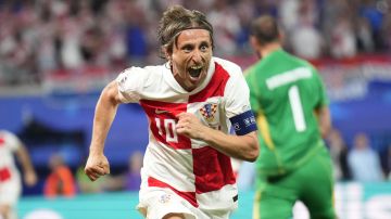 Croatia's Luka Modric celebrates after scoring his side's opening goal during a Group B match between Croatia and Italy at the Euro 2024 soccer tournament in Leipzig, Germany, Monday, June 24, 2024. (AP Photo/Ebrahim Noroozi)