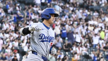 Los Angeles Dodgers' designated hitter Shohei Ohtani rounds the bases after hitting a home run during the first inning of a baseball game against the Chicago White Sox, Wednesday, June 26, 2024, in Chicago. (AP Photo/Matt Marton)
