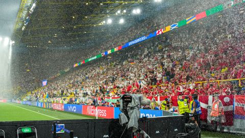 Heavy rain falls as play is suspended during a round of sixteen match between Germany and Denmark at the Euro 2024 soccer tournament in Dortmund, Germany, Saturday, June 29, 2024. (AP Photo/Andreea Alexandru)