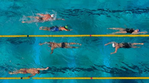 Simmers work out in a warm-up pool at the Los Angeles Invitational swimming meet at the University of Southern California, Thursday, July 17, 2014, in Los Angeles. (AP Photo/Mark J. Terrill)