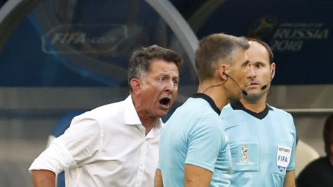 Mexico head coach Juan Carlos Osorio complains to a lineman during the round of 16 match between Brazil and Mexico at the 2018 soccer World Cup in the Samara Arena, in Samara, Russia, Monday, July 2, 2018. (AP Photo/Eduardo Verdugo)