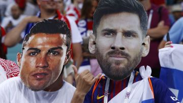 Fans wear masks with the face of the Portuguese national soccer star Cristiano Ronaldo and Argentina national soccer star Lionel Messi prior to the start of the quarterfinal match between Russia and Croatia at the 2018 soccer World Cup in the Fisht Stadium, in Sochi, Russia, Saturday, July 7, 2018. (AP Photo/Manu Fernandez)