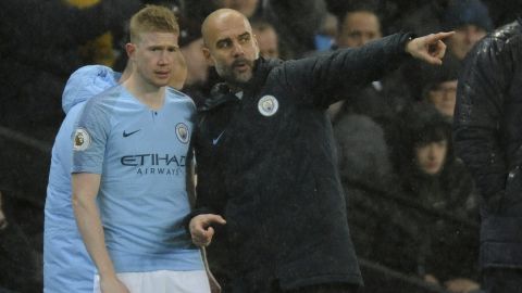 Manchester City manager Josep Guardiola, right, and Manchester City's Kevin De Bruyne during the English Premier League soccer match between Manchester City and Crystal Palace at Etihad stadium in Manchester, England, Saturday, Dec. 22, 2018. (AP Photo/Rui Vieira)