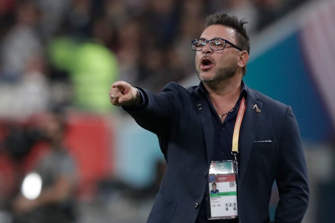 In this Dec. 18, 2019 photo, Monterrey's head coach Antonio Mohamed gives instructions from the side line during the Club World Cup semifinal soccer match between Liverpool and Monterrey at the Khalifa International Stadium in Doha, Qatar. Liverpool won 2-1. (AP Photo/Hassan Ammar)