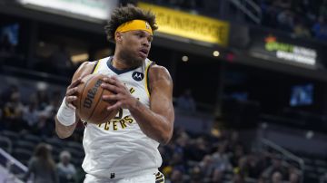 Indiana Pacers' Justin Anderson grabs a rebound during the first half of an NBA basketball game against the Atlanta Hawks, Monday, March 28, 2022, in Indianapolis. (AP Photo/Darron Cummings)
