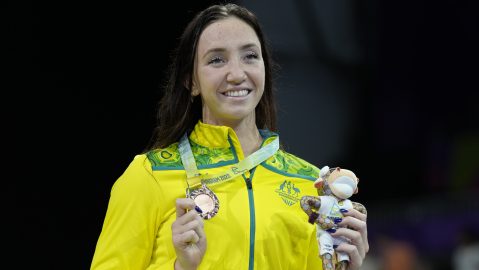 Bronze medalist Lani Pallister of Australia celebrates during a medal ceremony for the Women's 800m Freestyle Final of the swimming competition at the Commonwealth Games, at the Sandwell Aquatics Centre in Birmingham, England, Tuesday, Aug. 2, 2022. (AP Photo/Kirsty Wigglesworth)