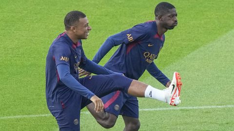 PSG's Kylian Mbappe, left, and PSG's Ousmane Dembele train at the Paris Saint-Germain training center Friday Aug. 18, 2023, in Poissy, west of Paris. (AP Photo/Michel Euler)