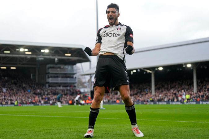 Fulham's Raul Jimenez celebrates after scoring his side's first goal during the English Premier League soccer match between Arsenal and Fulham at Craven Cottage stadium in London, Sunday, Dec. 31, 2023. (AP Photo/Alastair Grant)