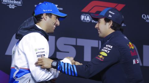 Daniel Ricciardo, left, of Australia driver of RB, the team previously known as AlphaTauri and Red Bull driver Sergio Perez of Mexico react ahead of the drivers press conference at the Australian Formula One Grand Prix at Albert Park, Melbourne, Australia, Thursday, March 21, 2024. (AP Photo/Asanka Brendon Ratnayake)