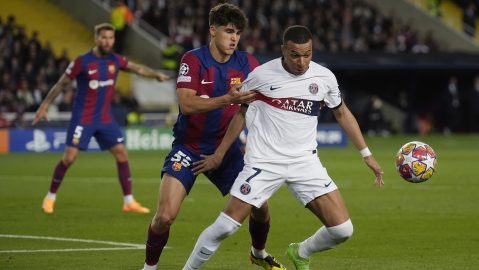 PSG's Kylian Mbappe, right, is challenged by Barcelona's Pau Cubarsi during the Champions League quarterfinal second leg soccer match between Barcelona and Paris Saint-Germain at the Olimpic Lluis Companys stadium in Barcelona, Spain, Tuesday, April 16, 2024. (AP Photo/Emilio Morenatti)