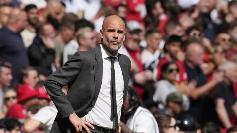 Manchester City's head coach Pep Guardiola gestures during the English FA Cup final soccer match between Manchester City and Manchester United at Wembley Stadium in London, Saturday, May 25, 2024. (AP Photo/Kin Cheung)