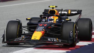 Red Bull driver Sergio Perez of Mexico steers his car during the Austrian Formula One Grand Prix race at the Red Bull Ring racetrack in Spielberg, Austria, Sunday, June 30, 2024. (AP Photo/Darko Bandic)
