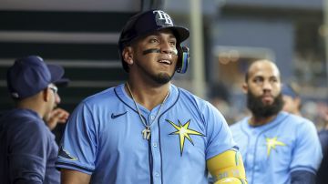 Tampa Bay Rays' Isaac Paredes, center, celebrates after his home run against the Washington Nationals during the second inning of a baseball game Sunday, June 30, 2024, in St. Petersburg, Fla. (AP Photo/Mike Carlson)