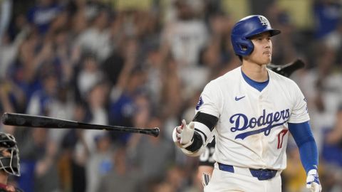 Los Angeles Dodgers designated hitter Shohei Ohtani tosses his bat after hitting a go-ahead two-run home run during the seventh inning of a baseball game against the Arizona Diamondbacks, Tuesday, July 2, 2024, in Los Angeles. (AP Photo/Ryan Sun)