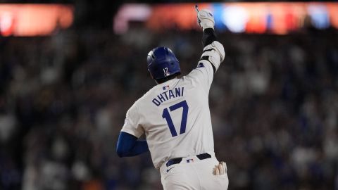 Los Angeles Dodgers designated hitter Shohei Ohtani celebrates while running the bases after hitting the go-ahead two-run home run during the seventh inning of a baseball game against the Arizona Diamondbacks, Tuesday, July 2, 2024, in Los Angeles. (AP Photo/Ryan Sun)