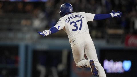 Los Angeles Dodgers' Teoscar Hernandez celebrates after hitting a walk-off single to score Freddie Freeman during the ninth inning of a baseball game against the Arizona Diamondbacks, Tuesday, July 2, 2024, in Los Angeles. (AP Photo/Ryan Sun)