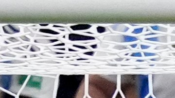 Argentina's goalkeeper Emiliano Martinez stops a penalty shot by Ecuador's Angel Mena during a penalty shootout at Copa America quarterfinal soccer match in Houston, Thursday, July 4, 2024. (AP Photo/Kevin M. Cox)