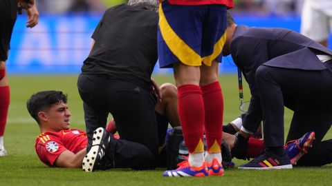 Spain's Pedri is treated after suffering an injury during a quarter final match between Germany and Spain at the Euro 2024 soccer tournament in Stuttgart, Germany, Friday, July 5, 2024. (AP Photo/Manu Fernandez)