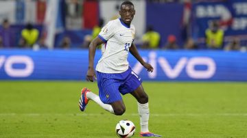 Randal Kolo Muani of France controls the ball during a quarter final match against Portugal at the Euro 2024 soccer tournament in Hamburg, Germany, Friday, July 5, 2024. (AP Photo/Hassan Ammar)