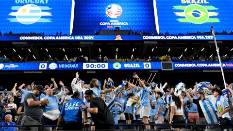 Fans of Uruguay celebrate after defeating Brazil in a penalty shootout during a Copa America quarterfinal soccer match in Las Vegas, Saturday, July 6, 2024.(AP Photo/David Becker)