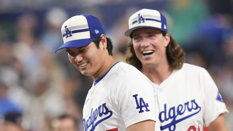 National League's Shohei Ohtani, left, and Tyler Glasnow, of the Los Angeles Dodgers, smile during the MLB baseball All-Star Home Run Derby, Monday, July 15, 2024, in Arlington, Texas. (AP Photo/LM Otero)