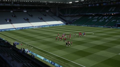 Canada's players walk on the pitch at Geoffroy-Guichard Stadium ahead of the 2024 Summer Olympics, Tuesday, July 23, 2024, in Saint-Etienne, France. Canada is scheduled to play New Zealand on Thursday, July 25. (AP Photo/Silvia Izquierdo)