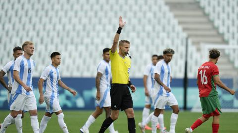 Referee Glenn Nyberg disallows a goal scored by Argentina's Cristian Medina during the Men's Group B soccer match between Argentina and Morocco at Geoffroy-Guichard stadium during the 2024 Summer Olympics, Wednesday, July 24, 2024, in Saint-Etienne, France. (AP Photo/Silvia Izquierdo)