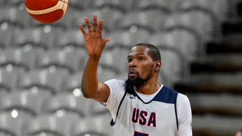 Kevin Durant gets a pass as the United State's men's team practiced before the start of the basketball competition at the 2024 Summer Olympics, Wednesday, July 24, 2024 in Villeneuve-d'Ascq, France. (AP Photo/Michael Conroy)