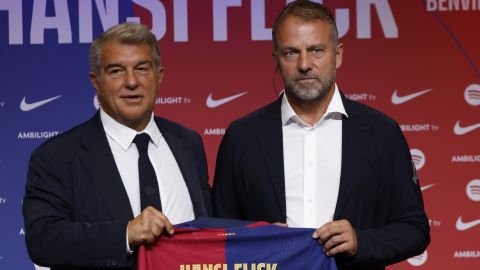 Barcelona's new coach Hansi Flick and Barcelona FC President, Joan Laporta, pose for a photo during an official presentation event of the new coach in Barcelona, Spain, Thursday, July 25, 2024. FC Barcelona and Hansi Flick have reached an agreement for the German to become men's first team football coach until 30 June 2026. (AP Photo/Joan Monfort)