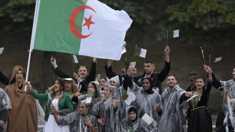 The boat carrying the Algeria team makes its way down the Seine in Paris, France, during the opening ceremony of the 2024 Summer Olympics, Friday, July 26, 2024. (AP Photo/Rebecca Blackwell)