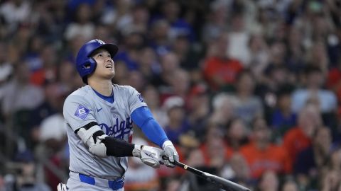 Los Angeles Dodgers designated hitter Shohei Ohtani flies out during the fifth inning of a baseball game against the Houston Astros, Sunday, July 28, 2024, in Houston. (AP Photo/Kevin M. Cox)