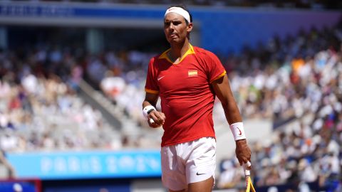 Spain's Rafael Nadal walks backs as he plays Serbia's Novak Djokovic during their men's singles second round match at the 2024 Summer Olympics, Monday, July 29, 2024, at the Roland Garros stadium in Paris, France. (AP Photo/Manu Fernandez)