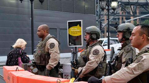 Los Angeles County Sheriff's deputies stand on guard at the Universal City Red Line station in Los Angeles on Tuesday, Dec. 6, 2016. Heavily armed sheriff's deputies are guarding the station and other parts of Los Angeles County's transit system following a threat of a terror attack against the busy commuter rail station. (AP Photo/Richard Vogel)