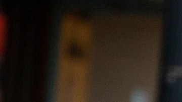 A pedestrian wears a face mask and gloves as she walks in the Chinatown neighborhood of Los Angeles on Thursday, April 2, 2020, during the coronavirus outbreak. (AP Photo/Damian Dovarganes)