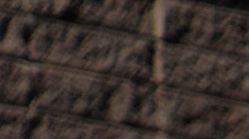 People visit a thermometer at the Furnace Creek Visitor Center, Thursday, Sept. 1, 2022, in Death Valley National Park, Calif. The thermometer is not official but is a popular photo spot. (AP Photo/John Locher)