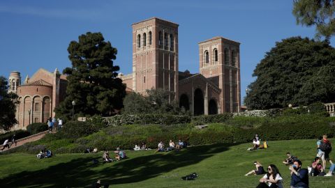 Students sit on the lawn near Royce Hall at UCLA Thursday, April 25, 2019, in the Westwood section of Los Angeles. Hundreds of students and staff at two Los Angeles universities, including UCLA, have been placed under quarantine because they may have been exposed to measles. Officials say the people affected by the order either have not been vaccinated or cannot verify that they are immune. (AP Photo/Jae C. Hong)