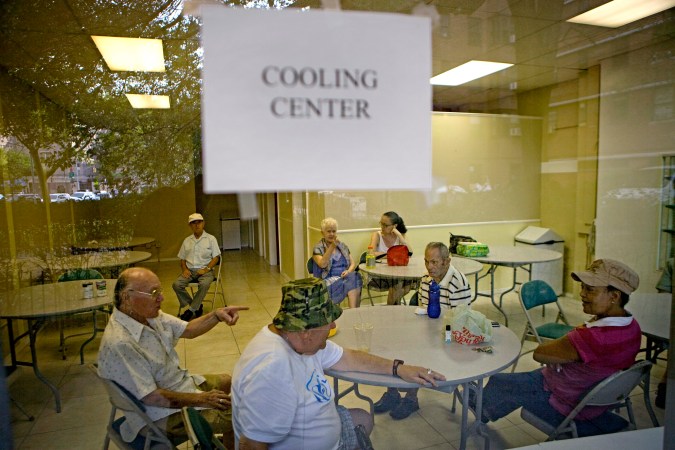 Residents of New York's Lower East Side neighborhood escape the heat in one of the city's designated cooling centers in New York, Saturday, July 24, 2010. More than 190,000 New Yorkers have visited cooling centers since the summer's first heat wave on June 28, the city said in a statement. (AP Photo/David Goldman)