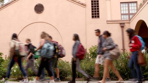 Students at Sequoia High School in Redwood City Calif. make their way bak to class after a special assembly on Thursday, Sept. 18, 2014. During the assembly Facebook gifted 50 laptops to the school and CEO Mark Zuckerberg answered questions in front of hundreds of students as part of Facebook's campaign to encourage students to pursue careers in science, technology, engineering and math or what are otherwise known as STEM fields. (AP Photo/Alex Washburn)