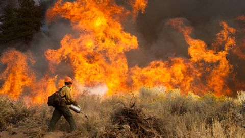 FILE - This Oct. 4, 2009 file photo shows Daniel Fawcett of the U.S. Forest Service setting a back-fire to combat a wildfire in Wrightwood, Calif. Since the 1997 international accord to fight global warming, climate change has worsened and accelerated, beyond some of the grimmest warnings. Officials from across the world will convene in Copenhagen next month to seek a follow-up pact, one that President Barack Obama says "has immediate operational effect...an important step forward in the effort to rally the world around a solution." (AP Photo/Francis Specker, File)