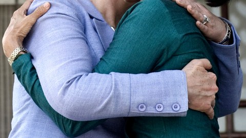 Myanmar's pro-democracy opposition leader Aung San Suu Kyi, right, and U.S. Secretary of State Hillary Rodham Clinton embrace after a meeting at Suu Kyi's residence in Yangon, Myanmar, Friday, Dec. 2, 2011. U.S. Secretary of State Clinton and opposition leader Suu Kyi, two of the world's most recognizable female leaders, pledged Friday to work together to bring democracy to Suu Kyi's long isolated and repressive nation. (AP Photo/Saul Loeb, Pool)