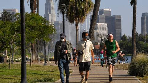 People utilize the Echo Park Lake recreation area Saturday, May 23, 2020, in Los Angeles during the coronavirus pandemic. California Gov. Gavin Newsom has approved 45 of California's 58 counties to reopen some businesses since May 8 when he loosened his original mid-March stay-at-home order. (AP Photo/Mark J. Terrill)