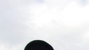 ** FILE ** Visitors gather in front of Cinderella's castle to watch Mickey and Minnie Mouse during the Christmas parade at Walt Disney World's Magic Kingdom in Lake Buena Vista, Fla, Dec. 22, 2004. A group of seven friends from Sydney _ all Disney fanatics organized a 32-day trip that takes them to every Disney park in the world _ from Tokyo to Hong Kong to Paris, to the U.S. flagships, Disneyland in Anaheim, Calif., and Walt Disney World near Orlando, Fla. (AP Photo/Peter Cosgrove)