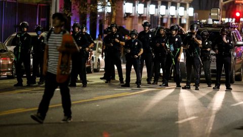Police officers stand guard as they clear the streets during a protest in Los Angeles, Wednesday, Nov. 4, 2020, following Tuesday's election. (AP Photo/Ringo H.W. Chiu)