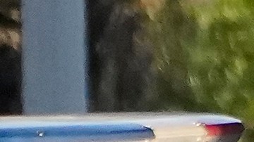 A Los Angeles Police officer and members of the Office of the Mayor of Los Angeles assist witnesses after two people were killed Tuesday, Aug. 2, 2022 in Los Angeles. Authorities say a driver who was fleeing police crashed into a homeless encampment in South Los Angeles, killing a man and a woman. (AP Photo/Damian Dovarganes)