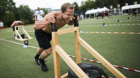 In this Aug. 5, 2017 photo Pit Ressler of Kiel's Foerde CrossFit pushes a sled during his third workout session at the fourth edition of the "Battle of Rostock", a CrossFit competition organized by the local CrossFit Box Sturmflut (German for storm flood), in Rostock, Germany. (AP Photo/Gero Breloer)