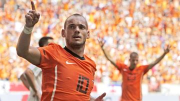 FILE - In this Saturday June 5, 2010 file photo Wesley Sneijder of The Netherlands celebrates scoring during the friendly soccer match Netherlands versus Hungary at ArenA stadium in Amsterdam, Netherlands. Midfielder Wesley Sneijder is retiring from international football after 15 years and a record 133 appearances for the Netherlands. The Dutch football association announced the retirement Sunday after new coach Ronald Koeman visited 33-year-old Sneijder in Qatar, where he plays for Al Gharafa. (AP Photo/Peter Dejong)